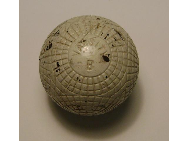 A very good Varsity B moulded mesh gutta-percha golf ball circa 1890