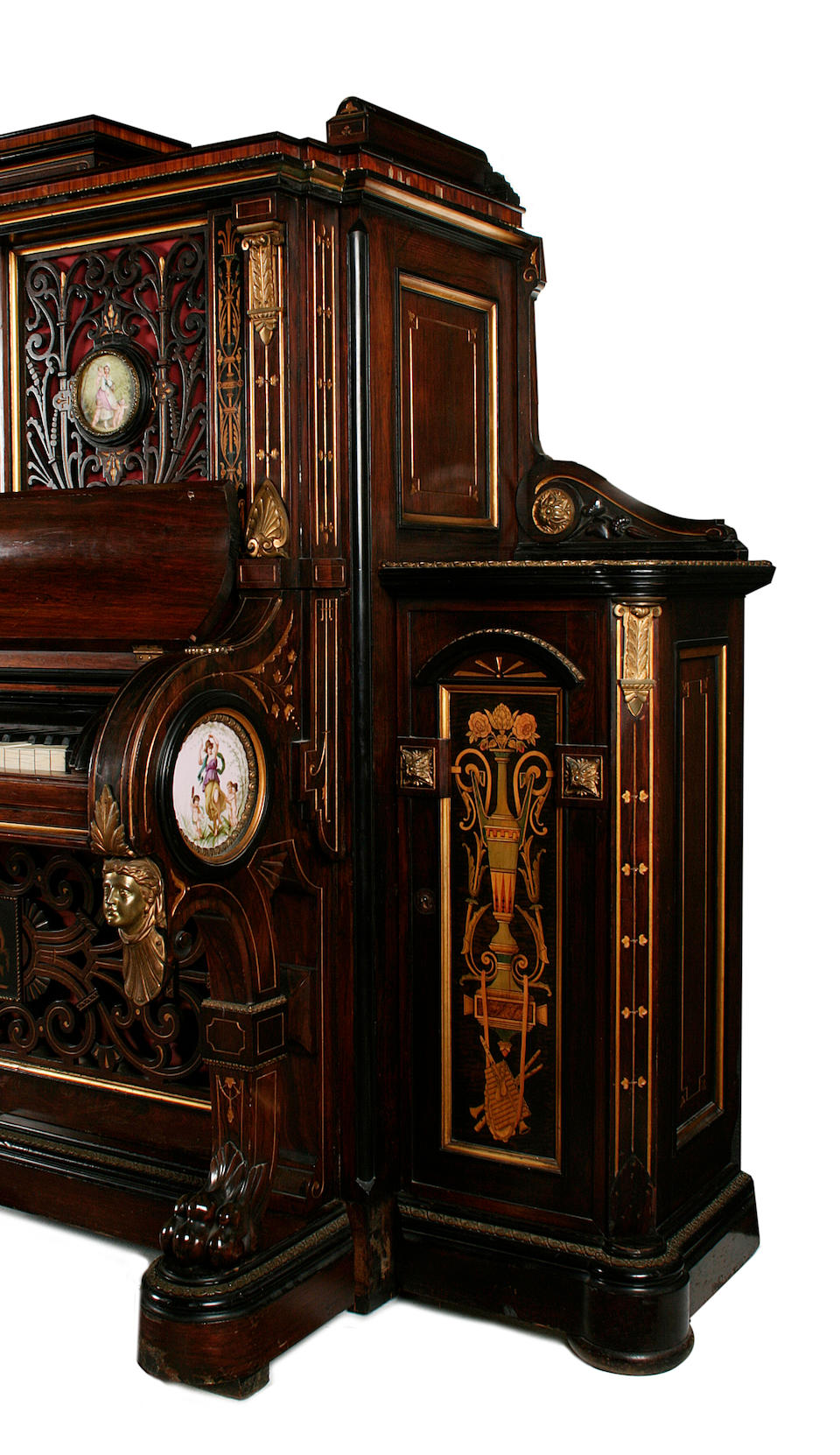 An important American late 19th century ormolu and porcelain-mounted, parcel-gilt, rosewood, tulipwood, sycamore, ebony, ebonised and marquetry upright piano by Steinway and Sons, index number 32260, New York, the cabinet work by E.W. Hutchings and Son, the painted porcelain plaques by A. Deligny, circa 1875