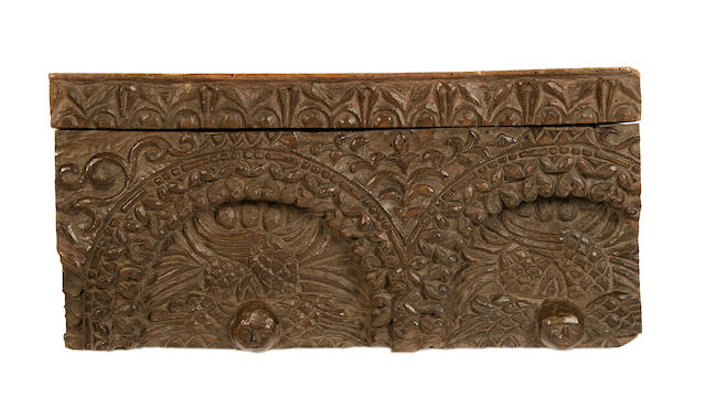 A Byzantine style carved walnut fragment depicting winged mythical beastspossibly 15th century