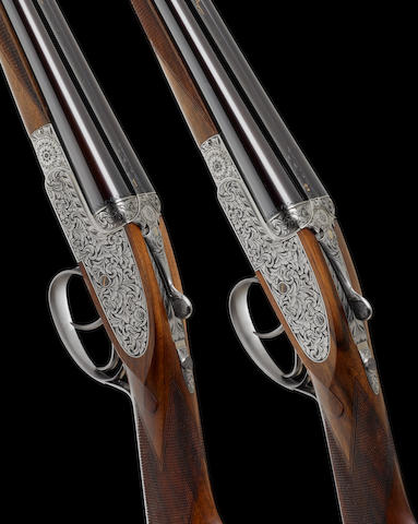 A fine pair of Portsmouth-engraved .410 (3in) self-opening sidelock ejector guns by Asprey, no. 1523/4 In their brass-mounted oak and leather case with makers accessories