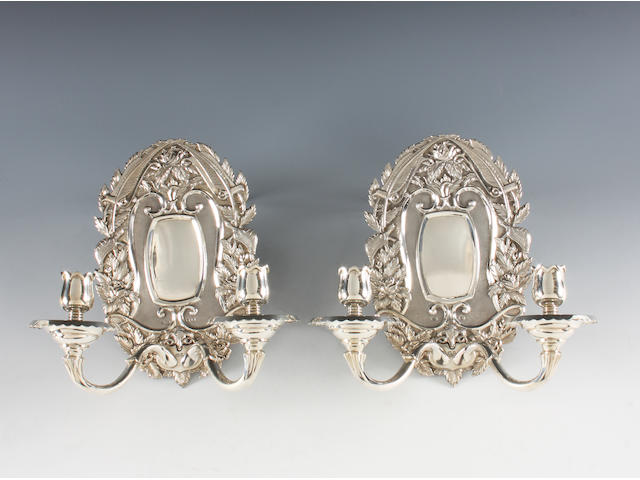 A pair of late 17th century style silver wall sconces By Asprey, London, 1960, with engraved retailer's mark to the reverse,  (2)
