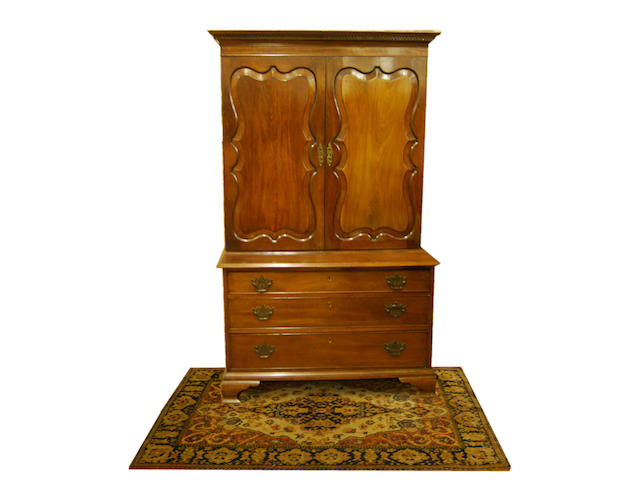 A mahogany cupboard on chest, in 18th Century style