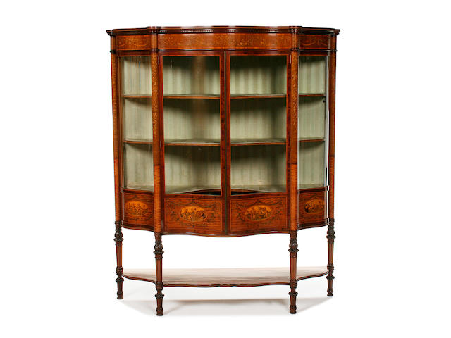 A fine Edwardian satinwood, mahogany, penwork and marquetry serpentine display cabinet by Maples