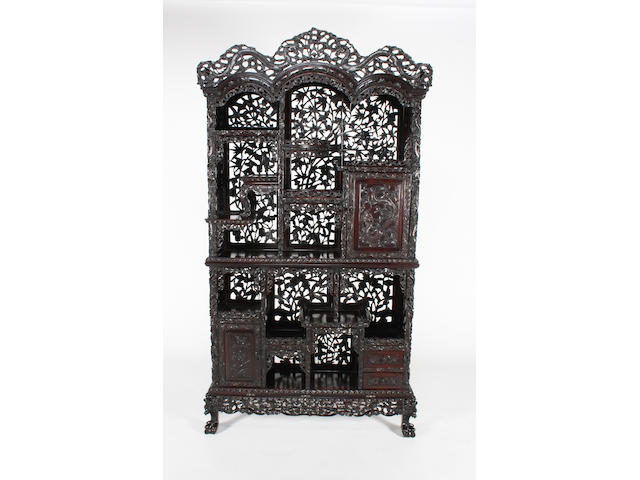 A good Chinese profusely carved and pierced hardwood display cabinet, late 19th century
