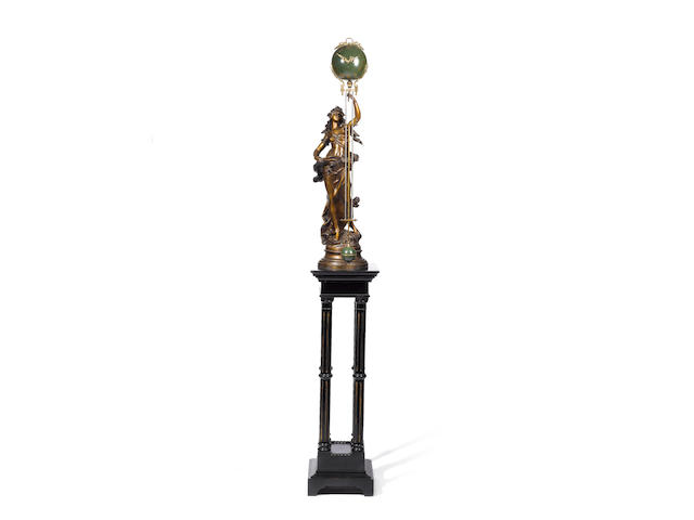 'La Recompense'.  A late 19th century French patinated spelter mystery clock The base with cast signature for Moreau