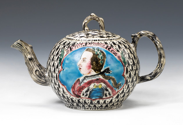 A Staffordshire salt-glazed stoneware 'King of Prussia' teapot and cover circa 1760 image 1