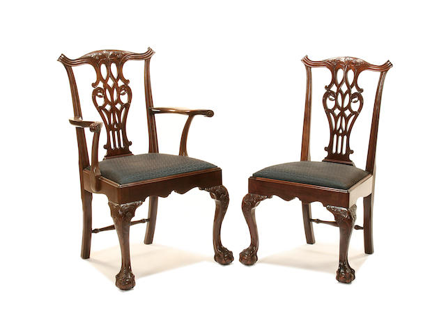 A set of twelve Chippendale style mahogany dining chairs