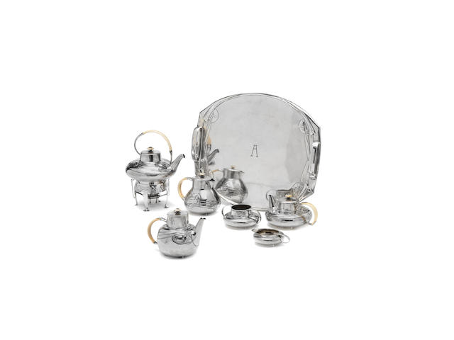 Archibald Knox for Liberty & Co. An important 'Cymric' silver and ivory Tea and Hot Chocolate Service on Tray, 1903 and 1905