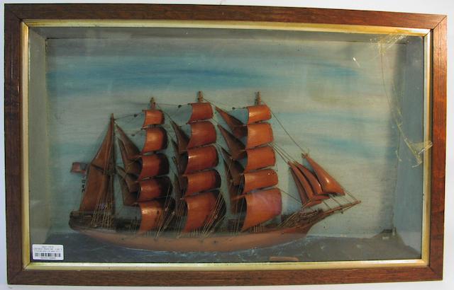 A diorama waterline model of a four masted Barque. 17.5x28x4in(44x71x10cm)