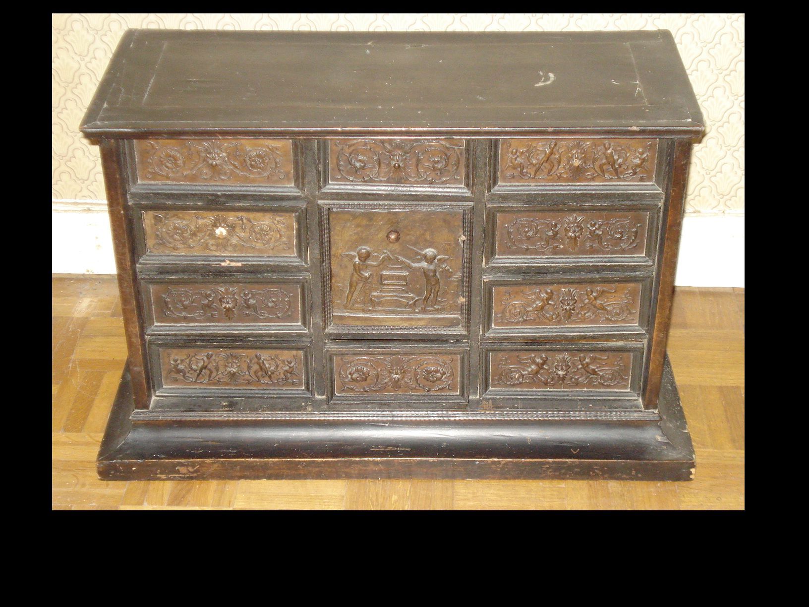 A continental ebonised table cabinet,