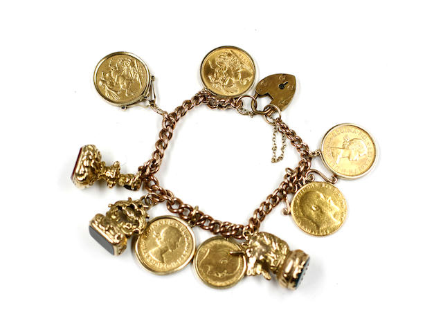 A 9ct curb link bracelet, to a padlock clasp, hung with five sovereigns, 1890, two x 1958, 1907, 1964, a half sovereign, 1905, and three stone set seals.