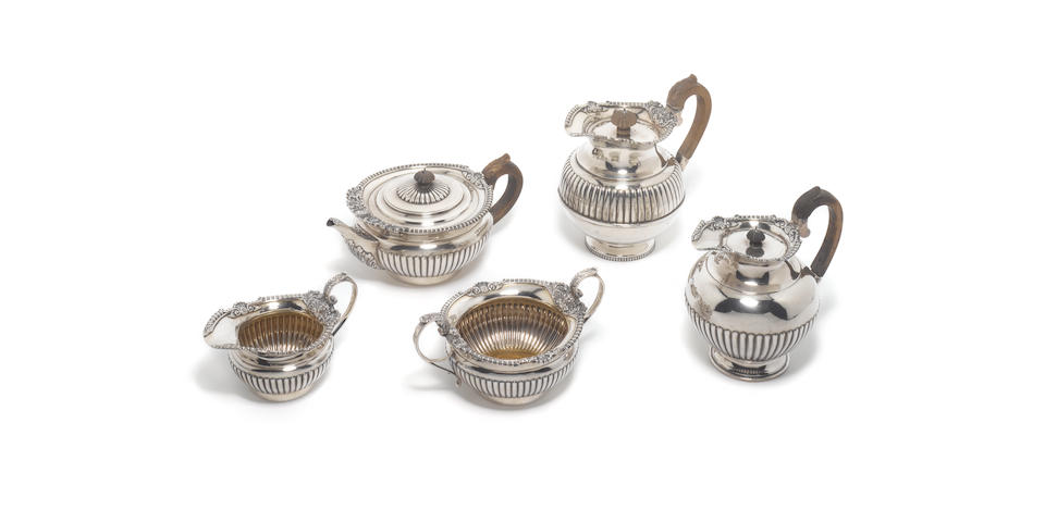 A Victorian silver four-piece tea service, by Walter & John Barnard, London 1894 and a matching hot water pot.  (5)