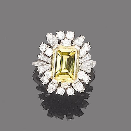 A treated yellow diamond and diamond dress ring