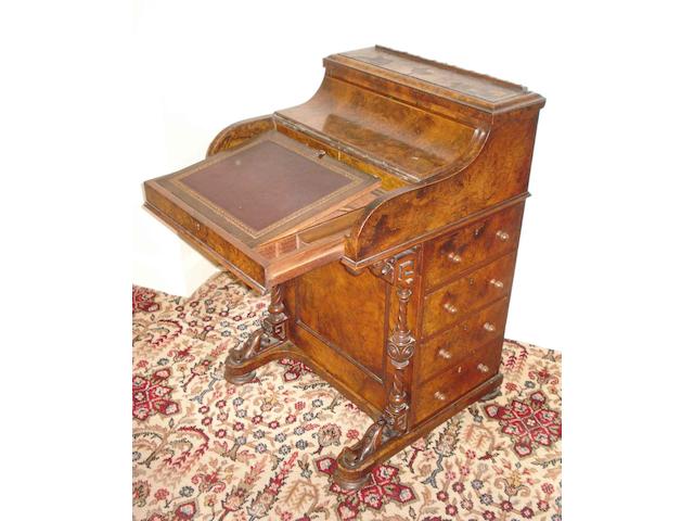 A 19th century walnut pop up piano front davenport