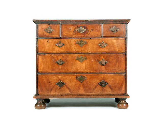 A Queen Anne and later walnut veneered chest, circa 1710