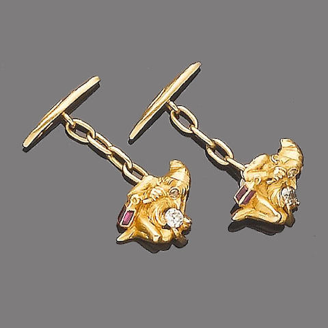 A pair of gold and gem-set cufflinks,