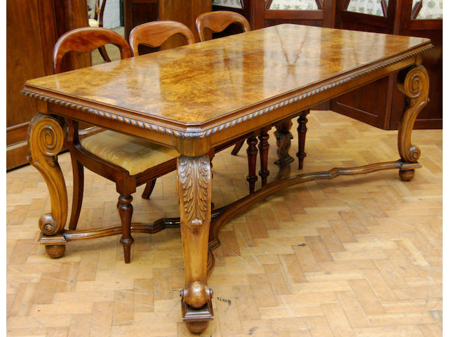 A figured walnut and walnut dining table, mid-20th Century