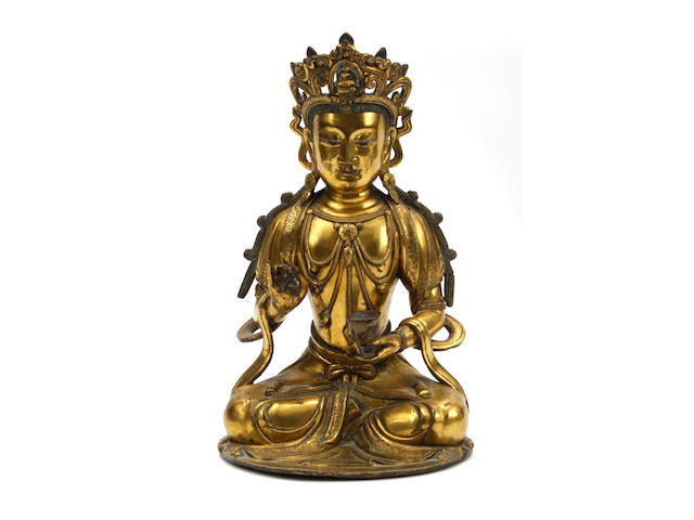 A gilt bronze figure of Buddha