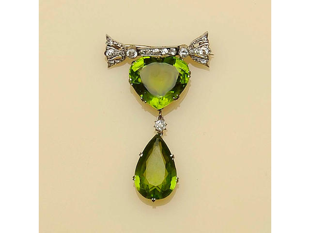 A peridot and diamond pendant/brooch