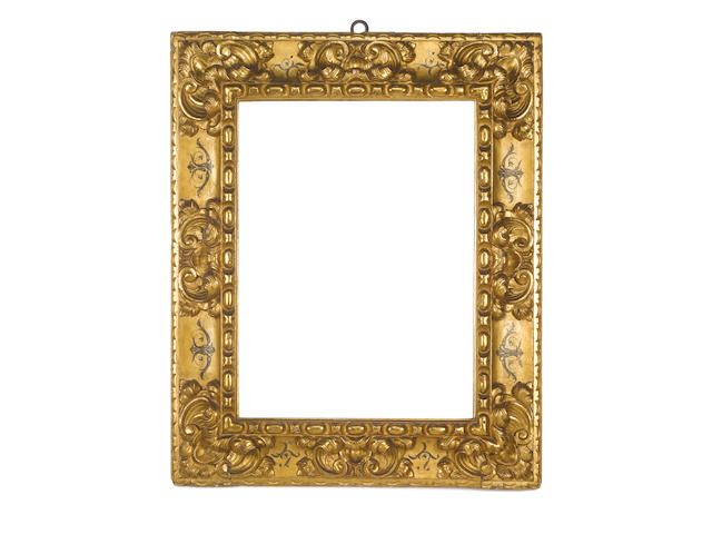 A Spanish 17th Century carved, gilded and polychromed frame