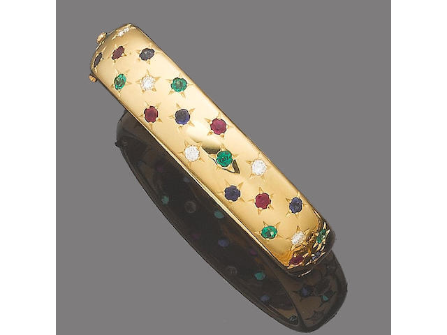 A gem-set and diamond hinged bangle, by Cartier