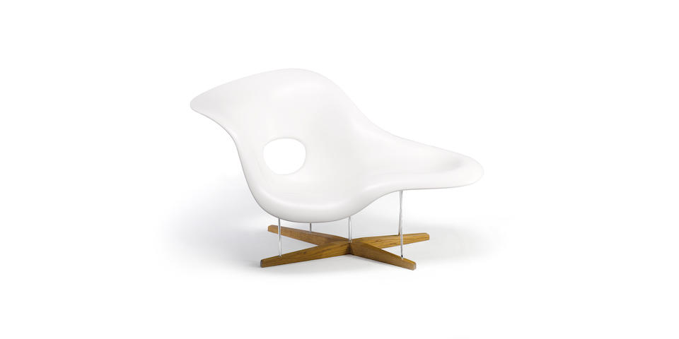 Charles and Ray Eames for Vitra, 'La Chaise', designed 1948 fibreglass shell, steel rod base and oak feet,