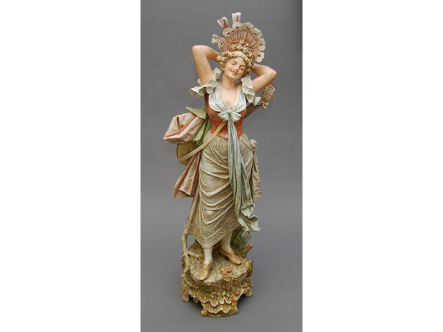 A very large Austrian porcelain figure of a lady with lute