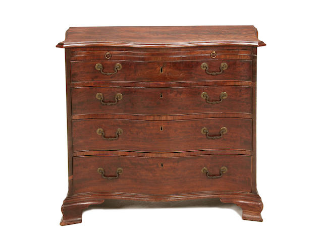 A good George III mahogany serpentine chest of drawers