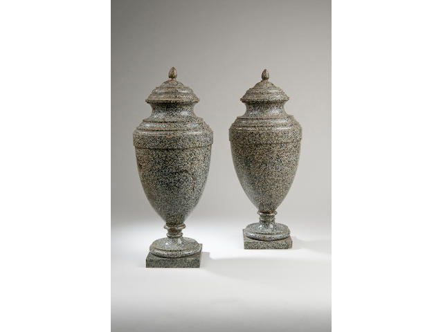 A pair of 19th Century green porphyry urns