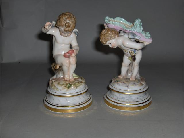 Two late Meissen figures, Cupid mending a heart,(needle a/f) and cupid carrying a slipper 17cm high (2)