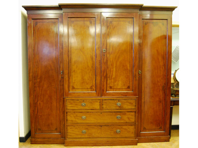 A large mahogany and inlaid breakfront wardrobe, late 19th Century