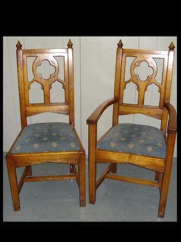 A set of eight 20th century carved oak dining chairs