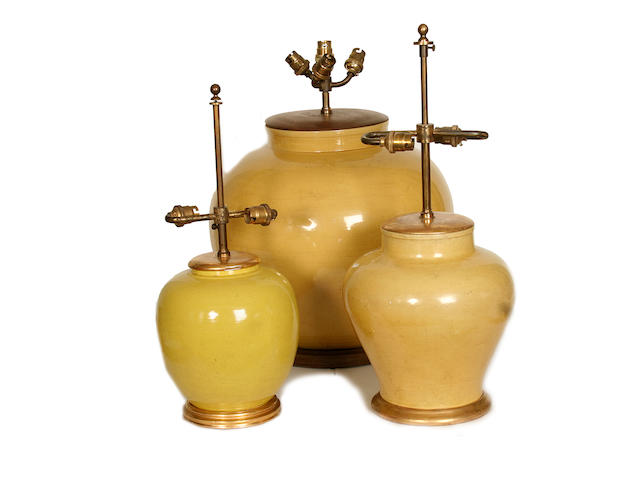 A collection of three various yellow glazed ceramic lamp bases