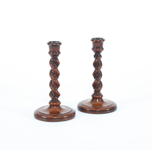 A pair of George III turned fruitwood candlesticks