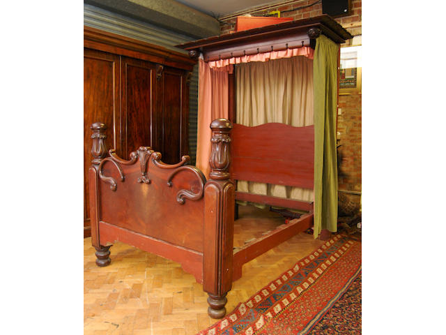 An early Victorian 4' 6" mahogany half tester bed