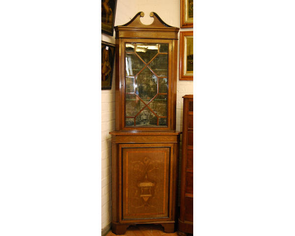 An Edwardian mahogany, inlaid and painted standing corner cupboard