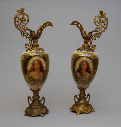 A pair of spelter and milk-glass ewers image 1