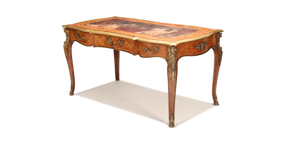 A Louis XV style gilt-brass mounted kingwood and marquetry bureau plat