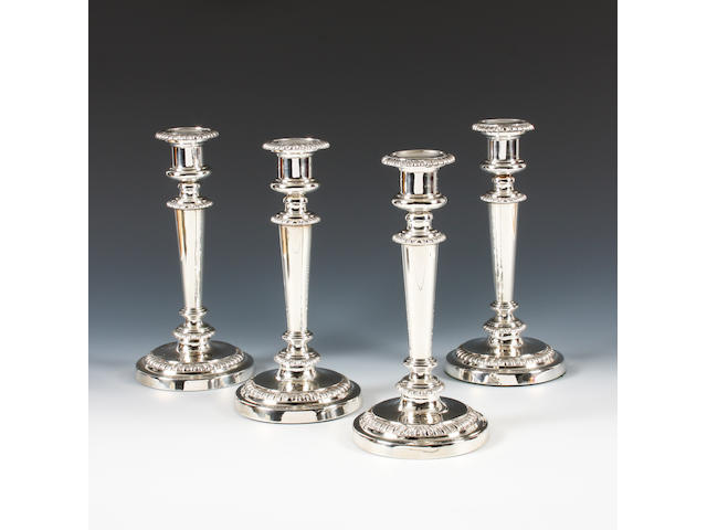 A set of four George III silver candlesticks By Mathew Boulton, Birmingham, 1827,  (4)