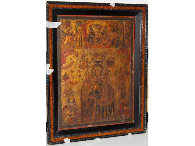 A Russian painted Icon, Mother of God Iverskaya - crowned on a gold ground panels of Saints above and at the corners, on wood panel, 51 x 38cm.