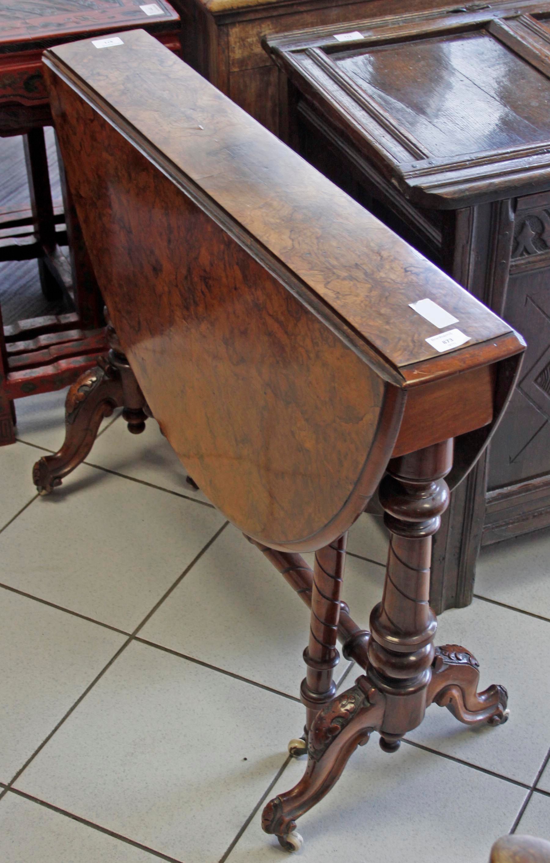 A Victorian walnut drop leaf tea table