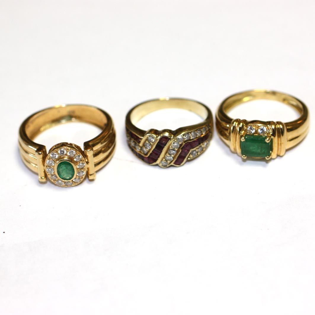 Three gem set rings,