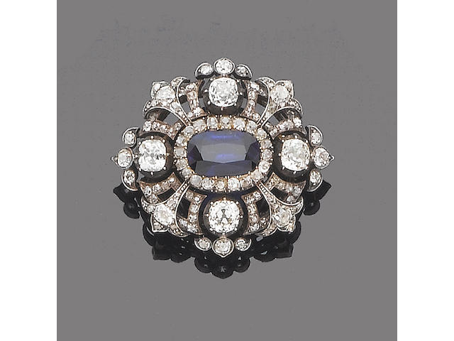 A sapphire and diamond cluster brooch/pendant,