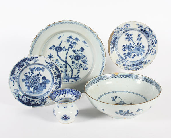 A delftware bowl, a large dish, two plates and a small spitoon 18th century