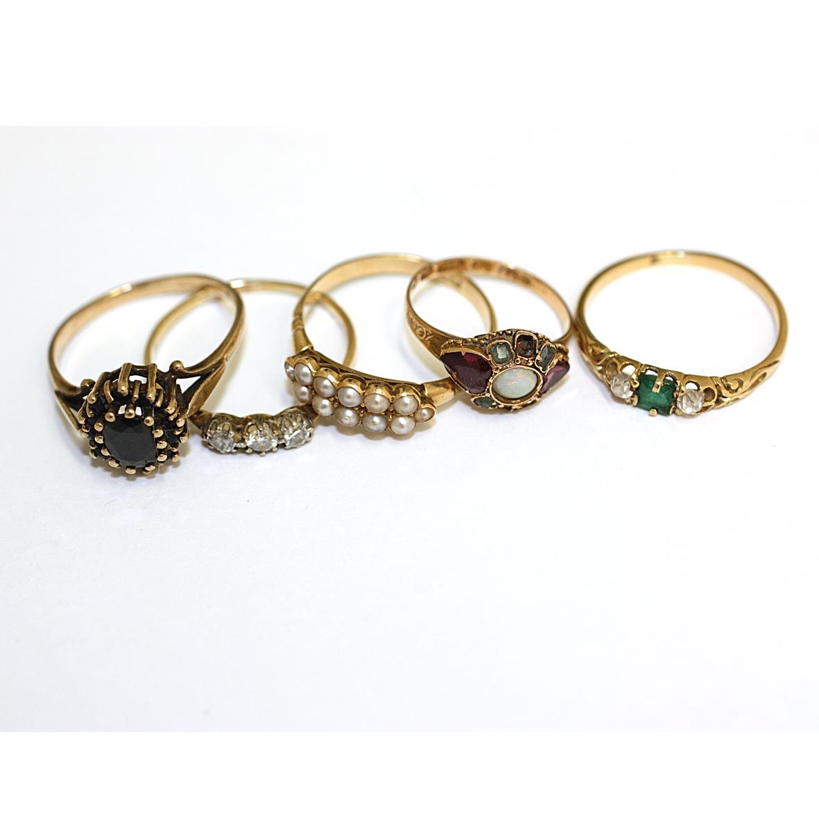 Five gem set rings, (5)