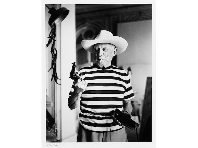 Andr&#233;  Villers (French, born 1930) Picasso with revolver and hat of Gary Cooper, Cannes, 1958