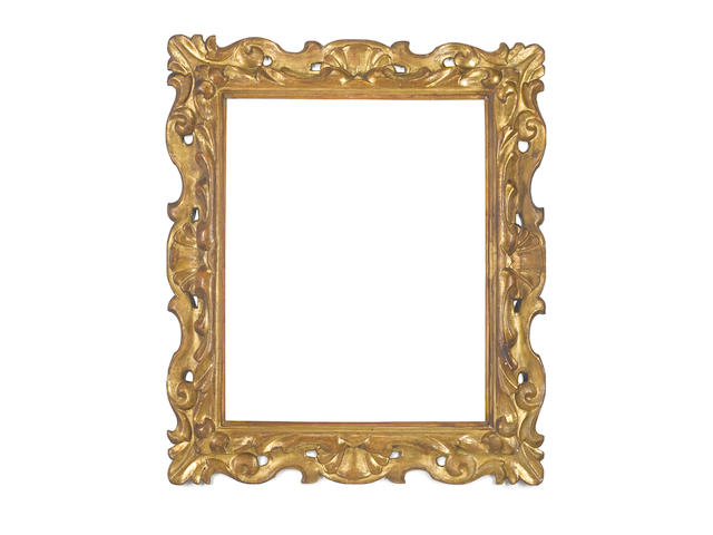 A Florentine 17th Century carved, pierced, swept and gilded frame
