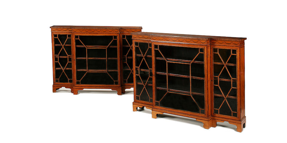 A pair of Edwardian satinwood and marquetry dwarf breakfront bookcases