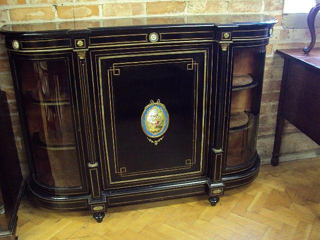 A Victorian ebonized and gilt metal-mounted bow-breakfront credenza