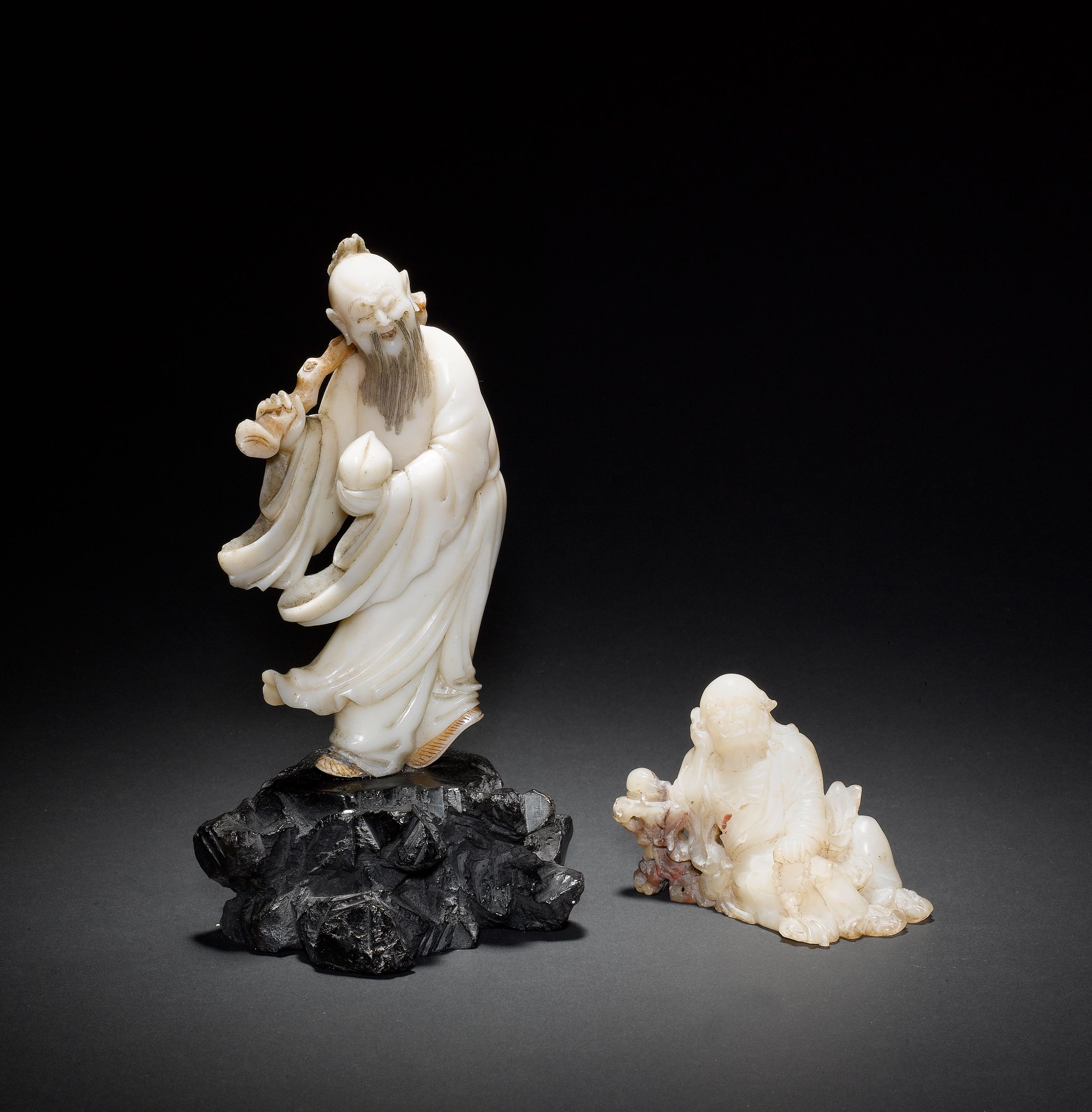 Two soapstone figures